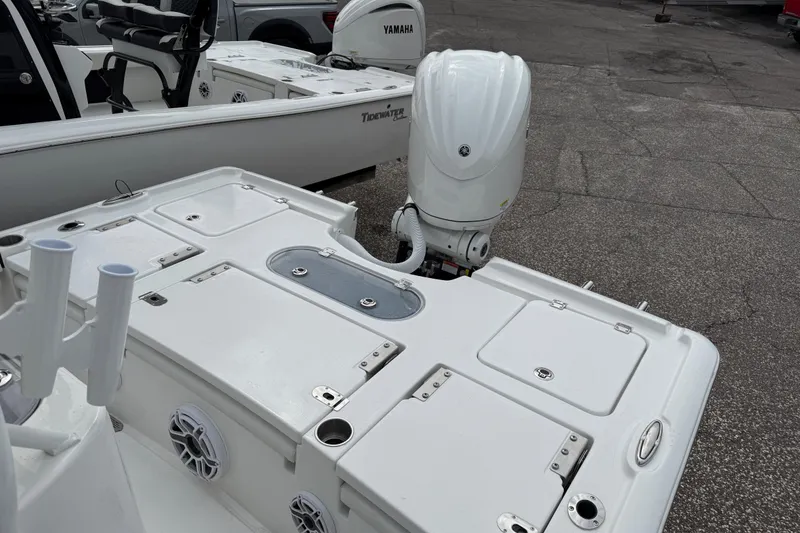 Slide: The Image of 2026 Tidewater 2500 Carolina Bay boat with Yamaha outboard motor, docked on pavement. - 7