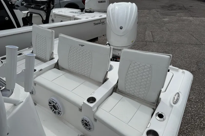Slide: The Image of 2026 Tidewater 2500 Carolina Bay boat with white seating and Yamaha engine. - 8