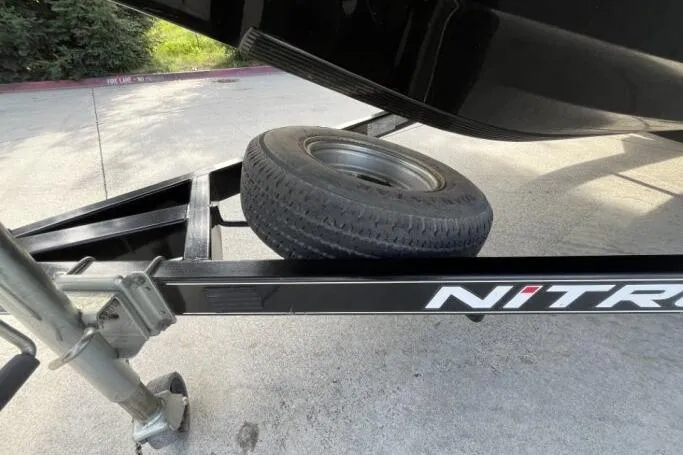 Slide: The Image of 2016 Nitro Z18 trailer with spare tire on concrete surface. - 18