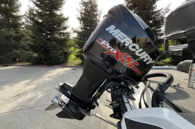 Slide: The Image of Mercury Pro XS outboard motor on 2016 Nitro Z18 boat, surrounded by trees. - 6