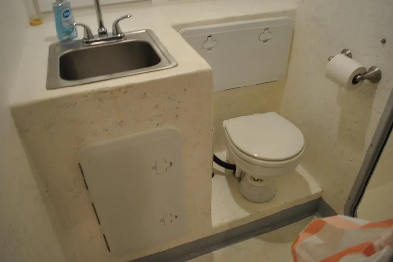Slide: The Image of Compact bathroom on 2019 Newton 53 dive boat with sink and toilet. - 20