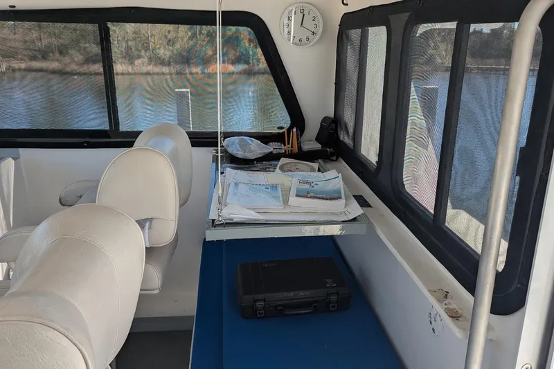 Slide: The Image of Interior of 2019 Newton 53 dive boat with navigation charts and equipment. - 25