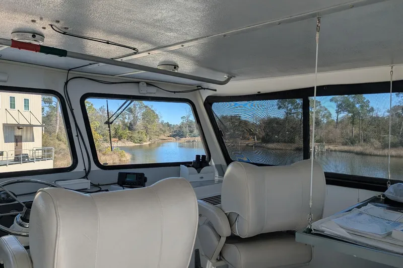 Slide: The Image of Interior view of 2019 Newton 53 dive boat with scenic river backdrop. - 29