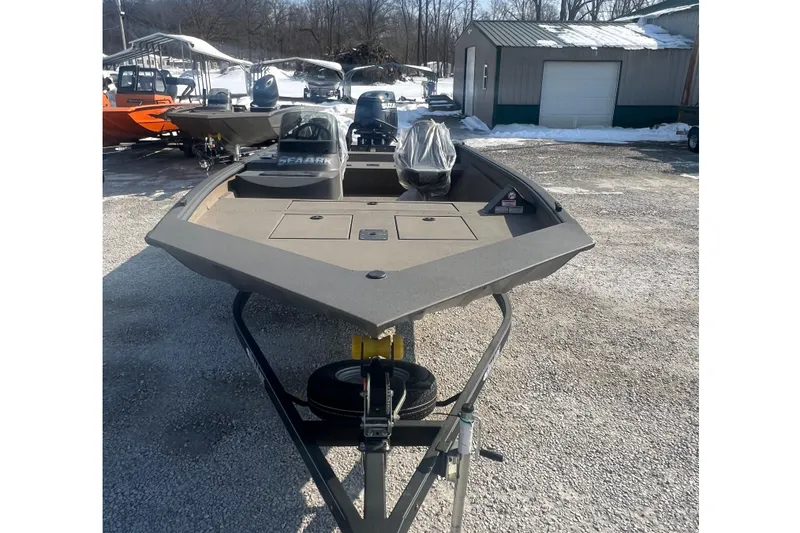 Slide: The Image of 2026 SeaArk Shadow 20T boat on trailer in snowy outdoor setting. - 7
