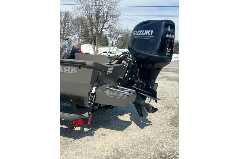 Slide: The Image of 2026 SeaArk Shadow 20T boat with Suzuki 140 outboard motor, parked outdoors. - 8