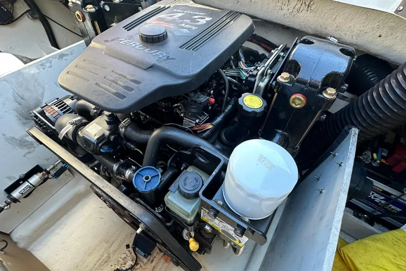 Slide: The Image of Engine compartment of a 2007 Sea Ray 195 Sport boat, featuring a Mercury engine. - 3