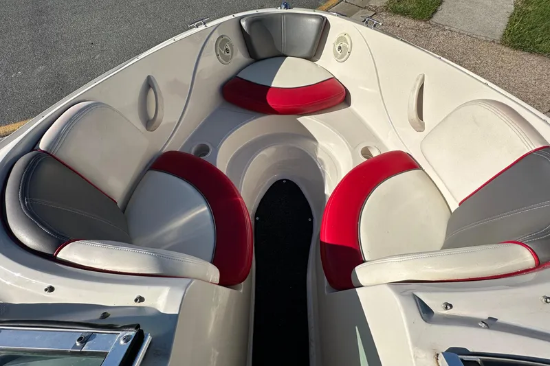 Slide: The Image of 2007 Sea Ray 195 Sport boat interior with red and gray seating. - 4