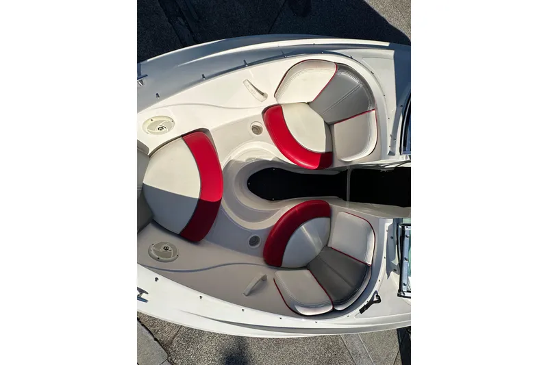Slide: The Image of 2007 Sea Ray 195 Sport boat interior with red and white seating. - 5