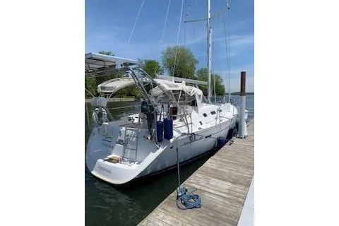 Slide: The Image of 2006 Beneteau Oceanis Clipper 393 sailboat docked at a marina. - 11