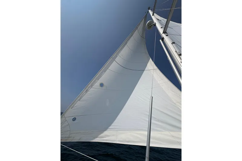 Slide: The Image of Sailing on a 2006 Beneteau Oceanis Clipper 393 under clear blue skies. - 2