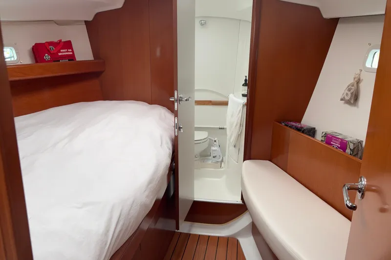 Slide: The Image of Cozy cabin interior of 2006 Beneteau Oceanis Clipper 393 with bed and bathroom. - 24