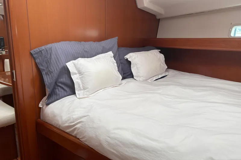 Slide: The Image of Cozy cabin interior of 2006 Beneteau Oceanis Clipper 393 with comfortable bedding. - 29
