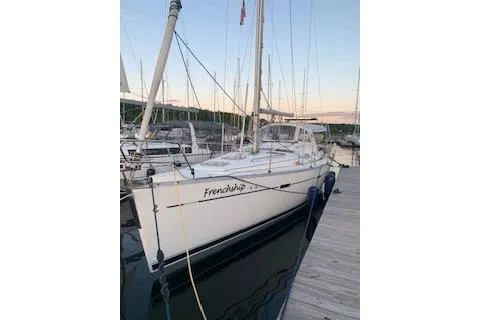 Slide: The Image of 2006 Beneteau Oceanis Clipper 393 sailboat docked at marina during sunset. - 6