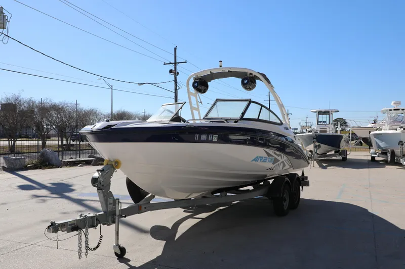 Slide: The Image of 2022 Yamaha Boats AR210 on trailer in sunny outdoor setting. - 5