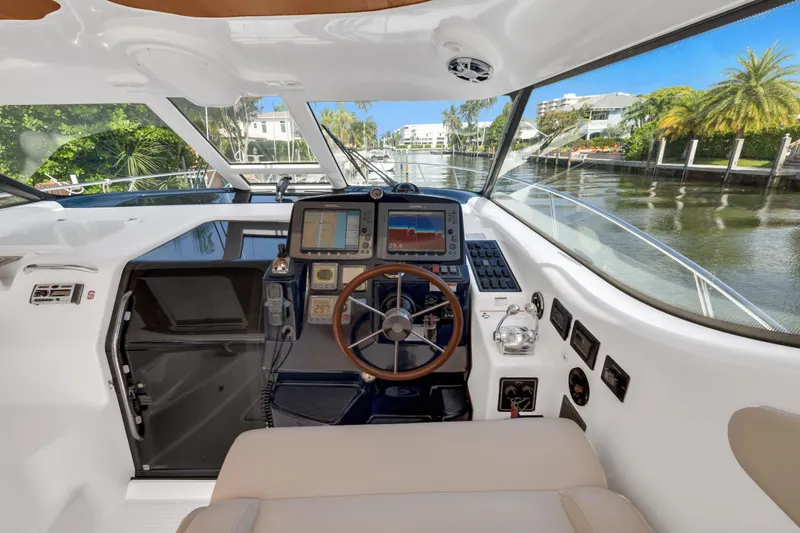 Slide: The Image of 2006 Tiara Yachts 4300 Sovran helm with navigation equipment. - 11