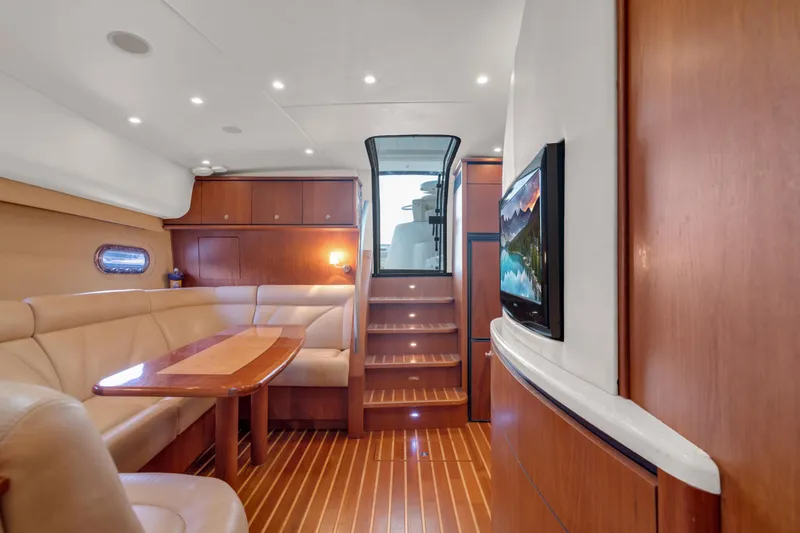 Slide: The Image of Interior of 2006 Tiara Yachts 4300 Sovran with wooden furnishings. - 12
