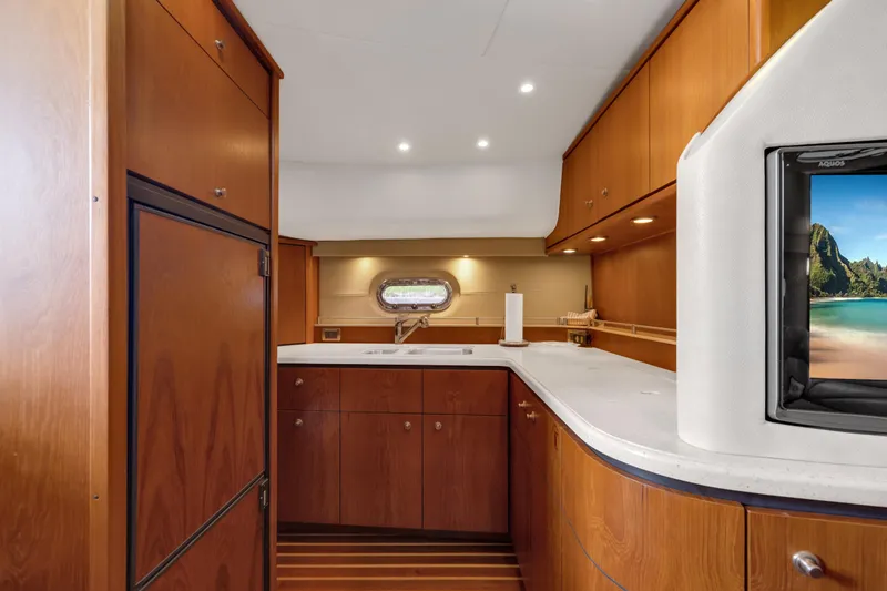 Slide: The Image of Interior of 2006 Tiara Yachts 4300 Sovran with wooden cabinetry. - 16