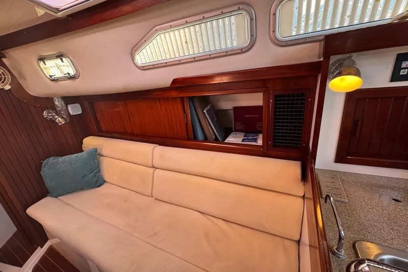 Slide: The Image of Cozy interior of 2006 Shannon Shoalsailer with beige sofa and wooden accents. - 16