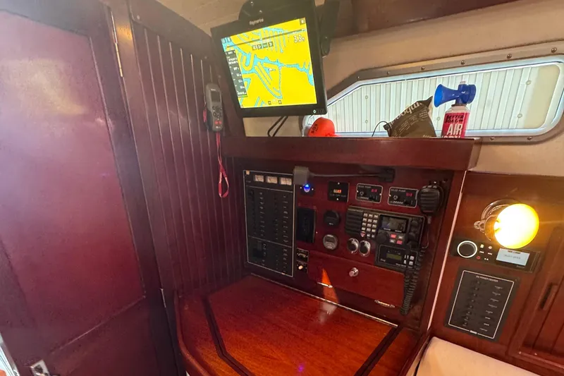 Slide: The Image of Navigation station of a 2006 Shannon Shoalsailer with electronic equipment and chart display. - 8