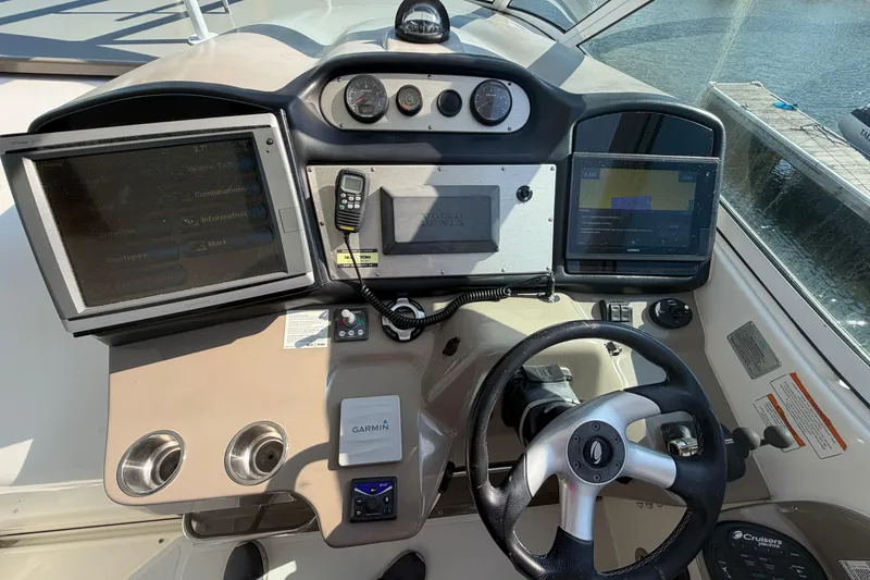 Slide: The Image of 2011 Cruisers Yachts 415 Express Motoryacht helm with Garmin navigation and control systems. - 12