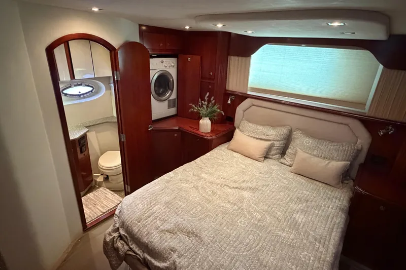 Slide: The Image of Luxurious 2011 Cruisers Yachts 415 Express Motoryacht bedroom with ensuite bathroom and washer-dryer. - 19