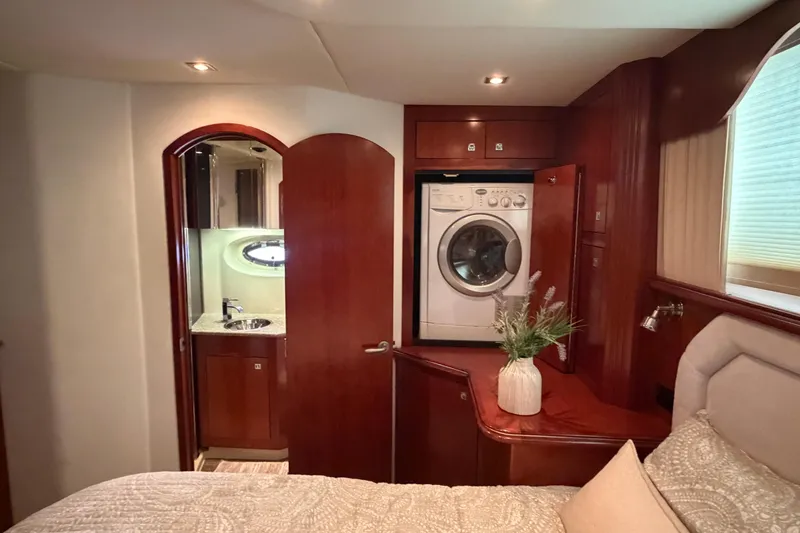 Slide: The Image of Luxurious 2011 Cruisers Yachts 415 Express Motoryacht interior with washer and elegant wood finish. - 21