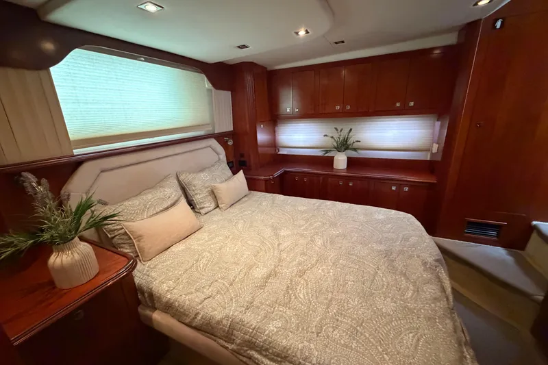 Slide: The Image of Luxurious bedroom in 2011 Cruisers Yachts 415 Express Motoryacht with elegant wood cabinetry. - 25