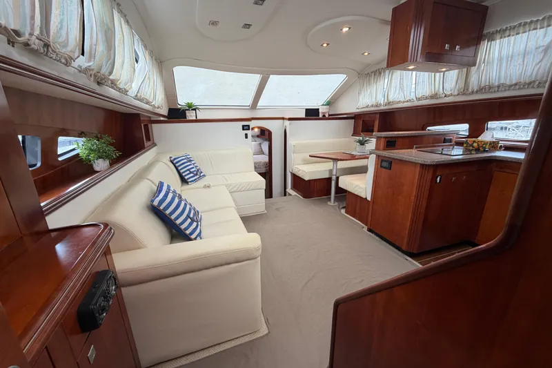 Slide: The Image of Luxurious interior of 2011 Cruisers Yachts 415 Express Motoryacht with elegant seating and wood finishes. - 27