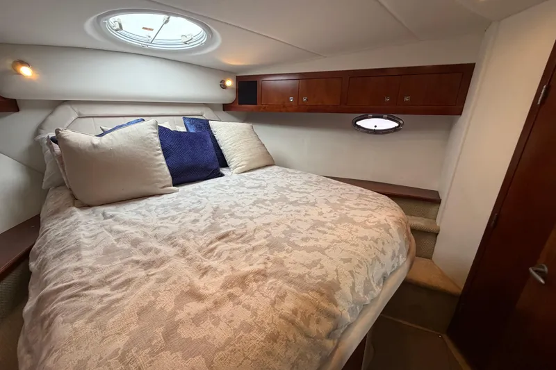 Slide: The Image of Luxurious bedroom interior of 2011 Cruisers Yachts 415 Express Motoryacht with plush bedding. - 36