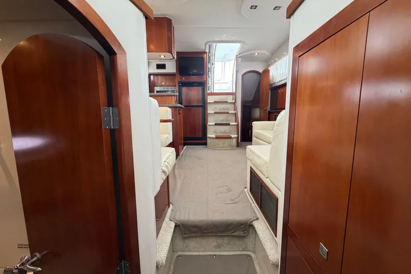 Slide: The Image of Interior of 2011 Cruisers Yachts 415 Express Motoryacht with wood finishes and seating. - 37