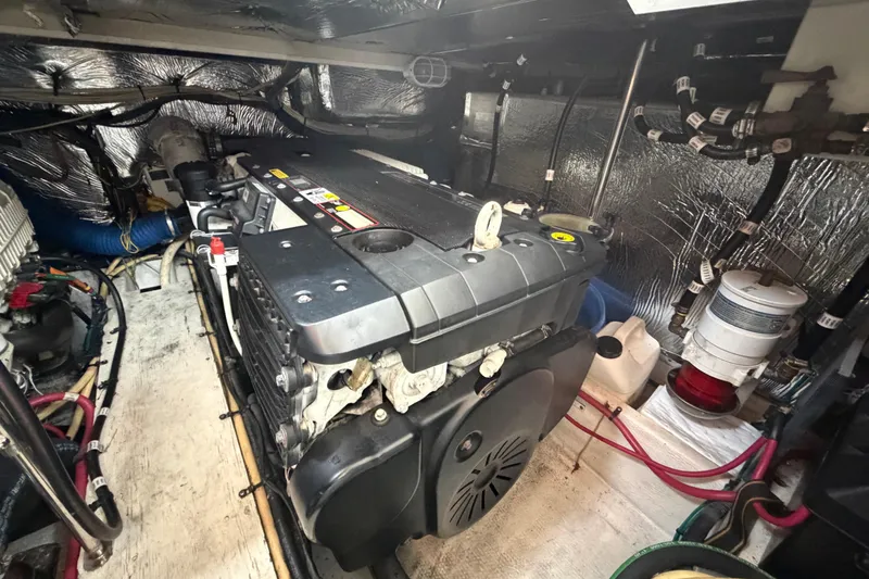 Slide: The Image of Engine room of 2011 Cruisers Yachts 415 Express Motoryacht, showcasing detailed mechanical components. - 38