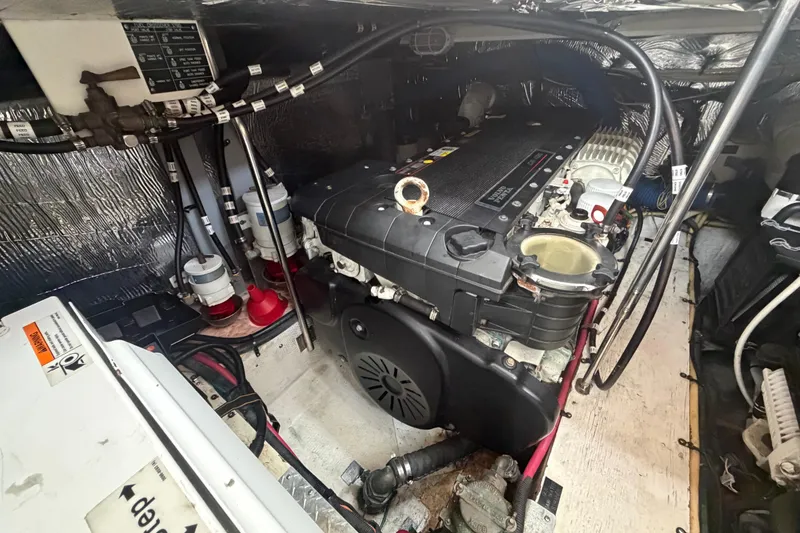 Slide: The Image of Engine room of 2011 Cruisers Yachts 415 Express Motoryacht, showcasing detailed mechanical components. - 40
