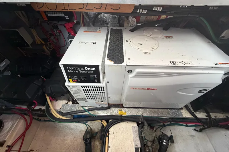 Slide: The Image of Cummins Onan marine generator in 2011 Cruisers Yachts 415 Express Motoryacht engine room. - 43