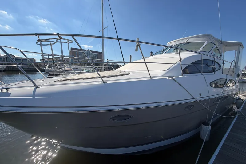 Slide: The Image of 2011 Cruisers Yachts 415 Express Motoryacht docked under clear blue sky. - 6