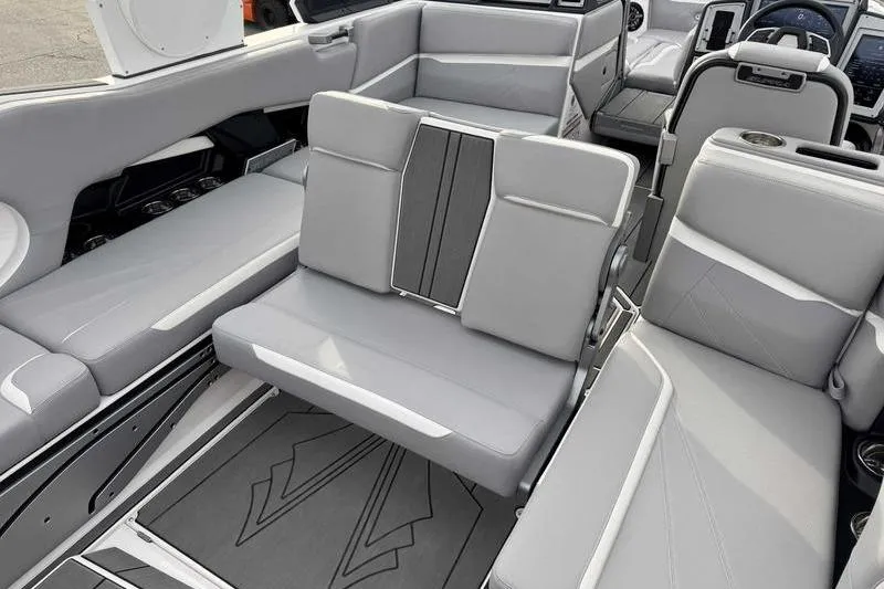 Slide: The Image of 2022 Supra SL boat interior with luxurious gray seating and modern design. - 11