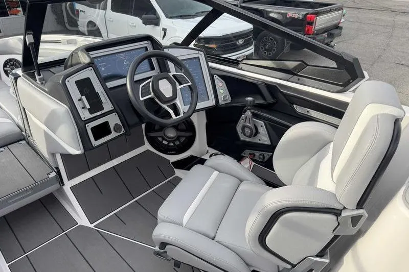 Slide: The Image of 2022 Supra SL boat interior with modern dashboard and steering wheel. - 15