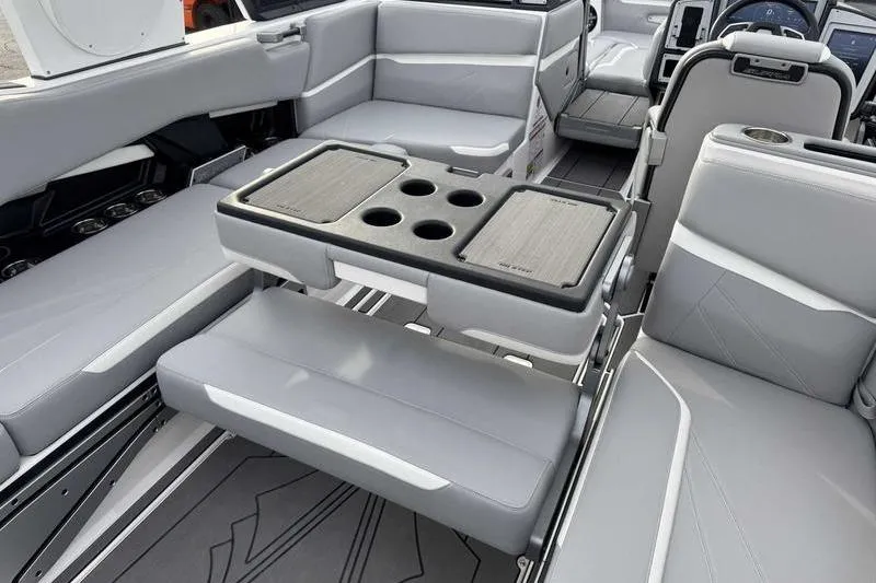 Slide: The Image of Luxurious interior of 2022 Supra SL boat with gray seating and cup holders. - 2