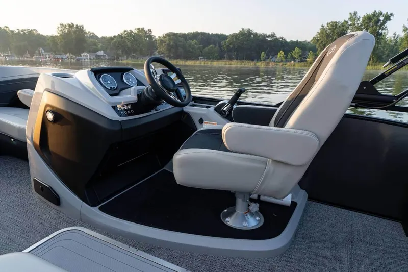 Slide: The Image of Manufacturer Provided Image: 2026 Barletta Cabrio 22UC boat interior with captain's chair and control panel. - 8