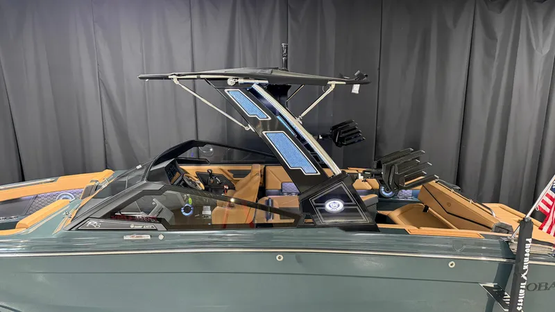 Slide: The Image of The image shows a modern 2027 Cobalt R8 Surf boat with sleek design and luxurious interior. - 5