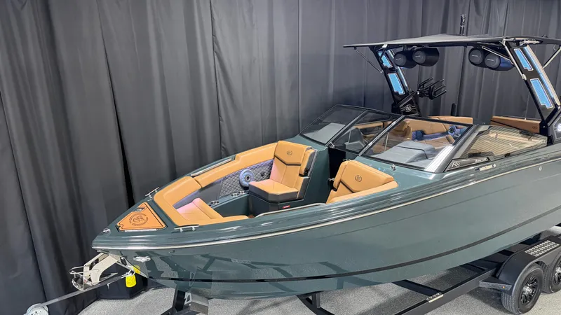 Slide: The Image of The image shows a modern 2027 Cobalt R8 Surf boat with sleek seating. - 4