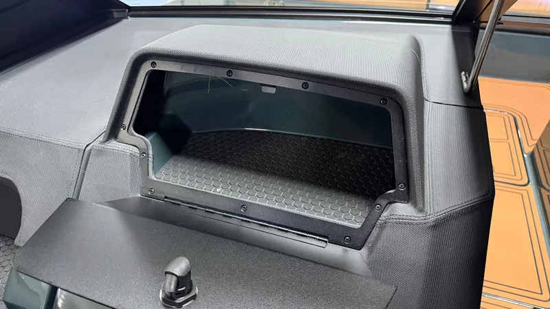 Slide: The Image of The image shows a modern dashboard with an open storage compartment. - 49