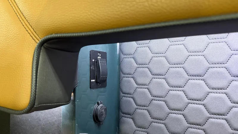 Slide: The Image of Close-up of a switch and socket in a boat with upholstered interior. - 27