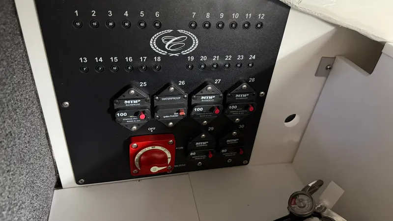 Slide: The Image of Control panel of the 2027 Cobalt R8 Surf with toggle switches and fuses. - 40