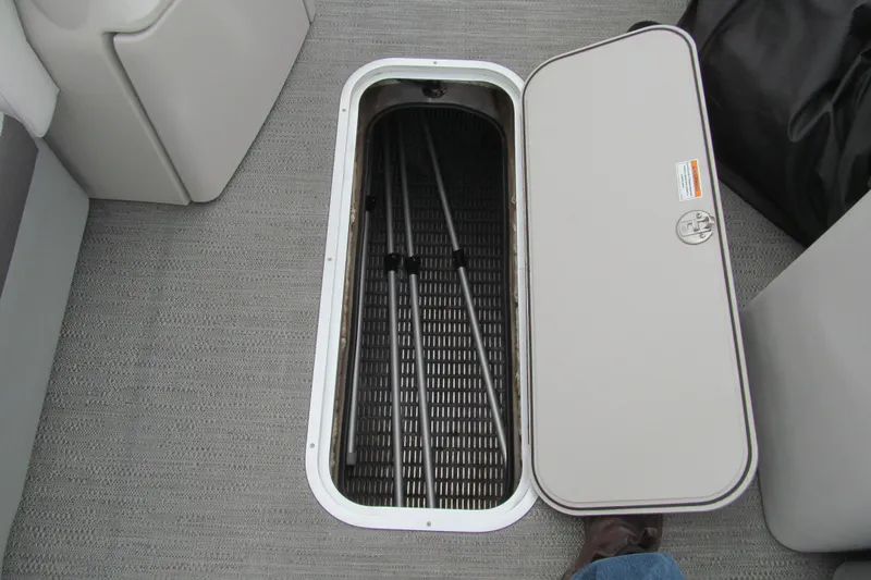 Slide: The Image of Open storage compartment on 2023 Godfrey Sweetwater 2286 C boat, revealing interior space. - 10