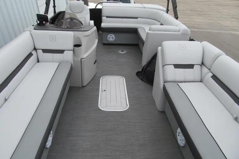 Slide: The Image of 2023 Godfrey Sweetwater 2286 C pontoon boat interior with plush seating and modern design. - 11