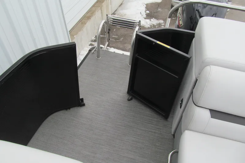 Slide: The Image of 2023 Godfrey Sweetwater 2286 C boat interior with open storage compartment and seating. - 15