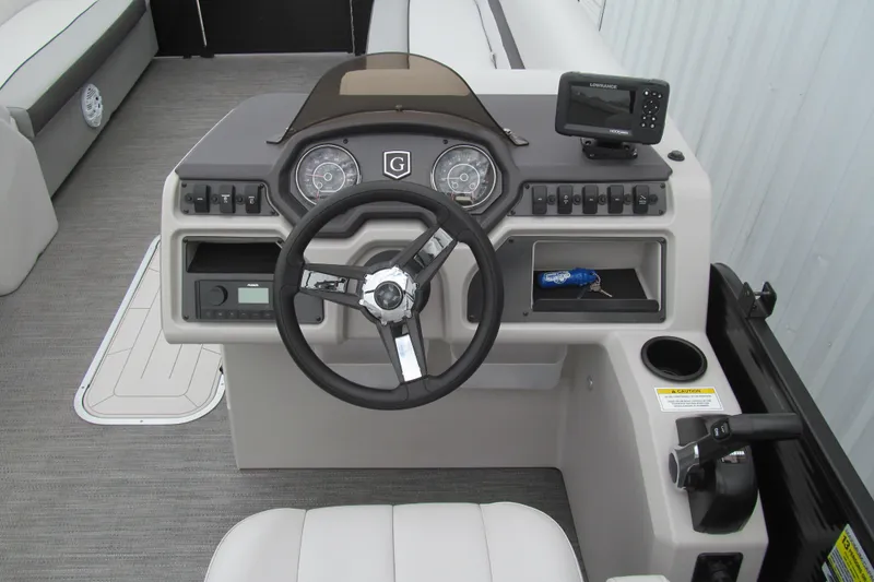 Slide: The Image of 2023 Godfrey Sweetwater 2286 C boat dashboard with steering wheel and controls. - 7