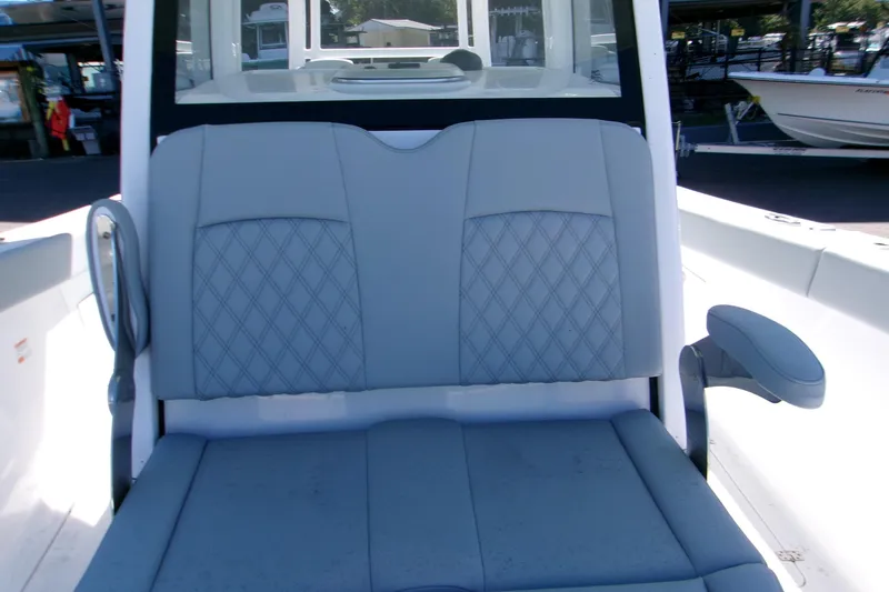 Slide: The Image of 2026 Sportsman Heritage 321 Center Console boat seat with diamond-pattern upholstery. - 12