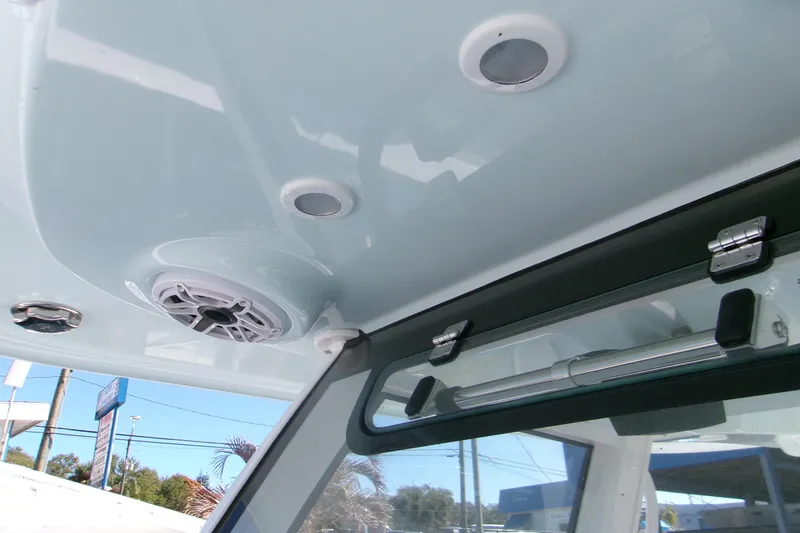 Slide: The Image of 2026 Sportsman Heritage 321 Center Console interior ceiling with speakers and hatch. - 14