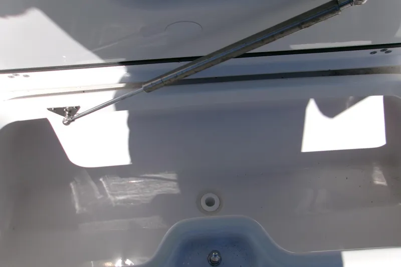 Slide: The Image of Open storage compartment on 2026 Sportsman Heritage 321 Center Console boat. - 18